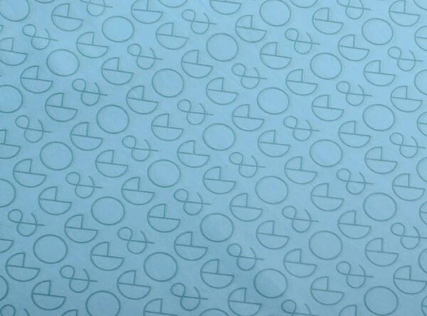 17gsm turquoise stock custom printed tissue paper Custom turquoise tissue paper printed with geometric logo and ampersand pattern in dark turquoise ink